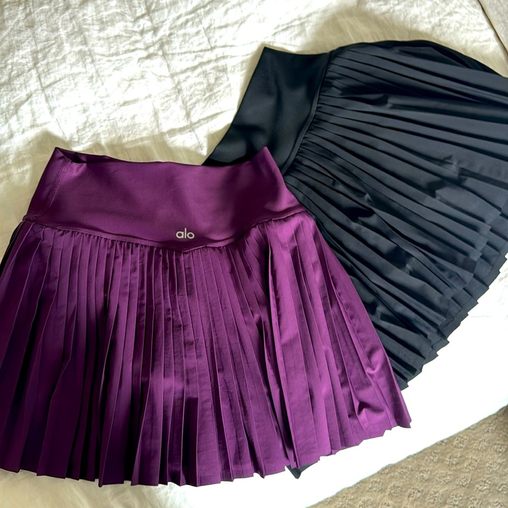 Two Alo pleated skirts